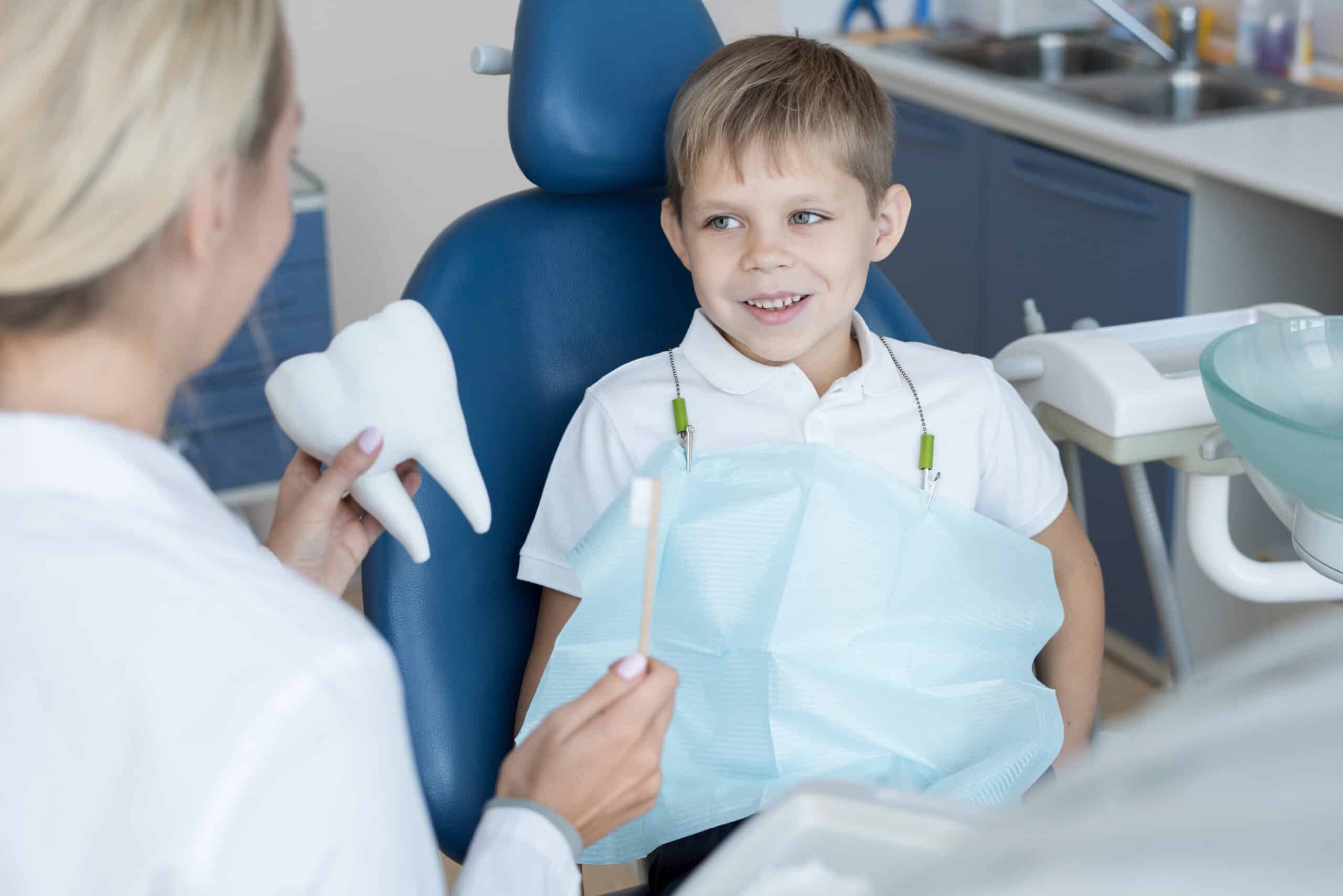 smiling child in dental chair